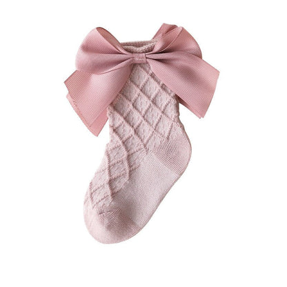 Folded pair of pink lace flower tube socks for kids, breathable cotton comfort