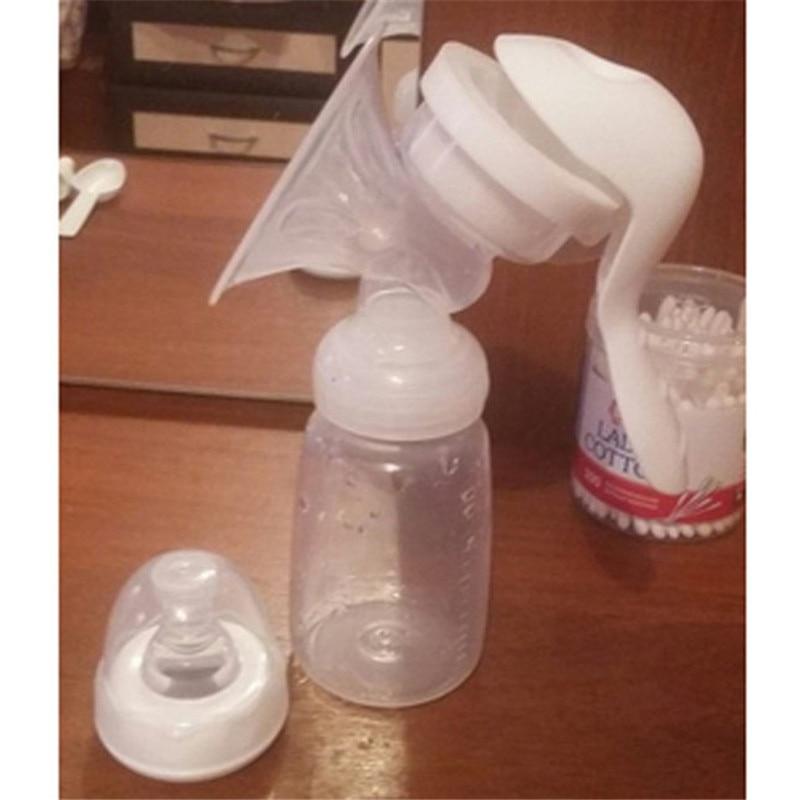 Compact manual breast pump for on-the-go milk collection, includes a convenient infant feeding bottle