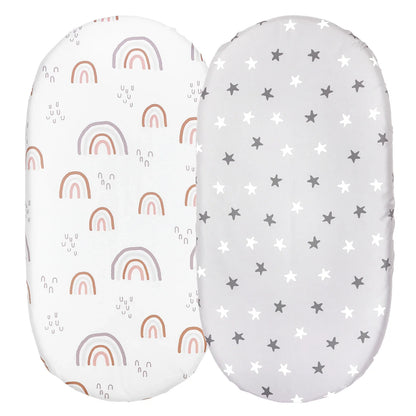 Two plain white microfiber bassinet sheets, essential baby bedding for any nursery decor.
