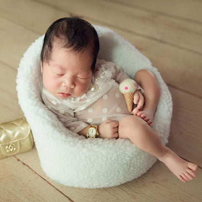 White mini sofa chair, perfect newborn photography prop for infant photo shoots. Soft cotton baby decor.