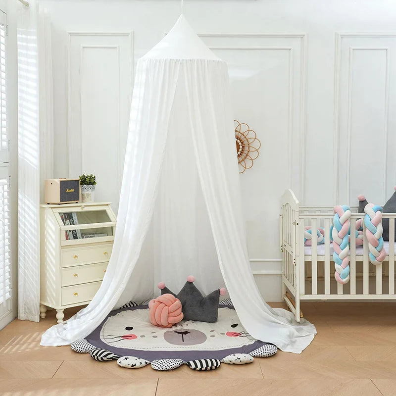 Royal baby nursery decor: white mosquito net bed canopy, ensures child safety.