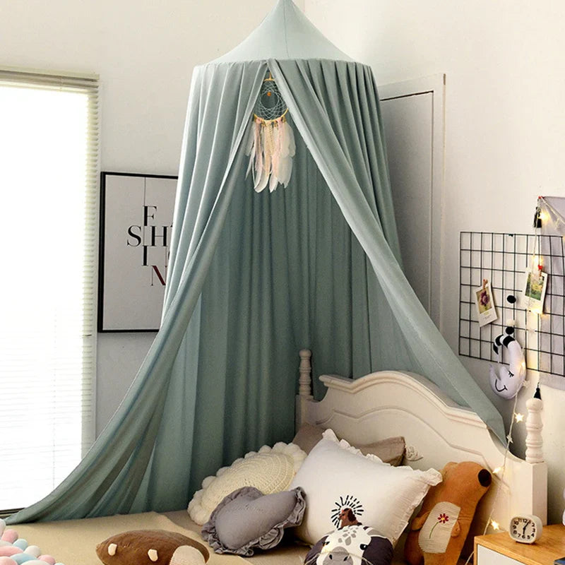 White mosquito net bed canopy, soft and flowing, for a serene and safe nursery.