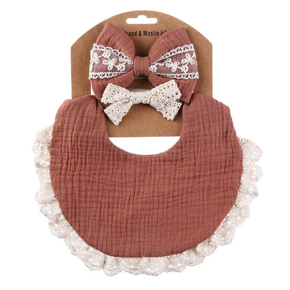 High-quality white muslin cotton baby bib, absorbent and gentle, with a pretty lace headband for baby girls.
