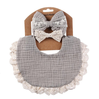 Infant nursing gift: white cotton baby bib and matching lace headband, designed for comfort and style.