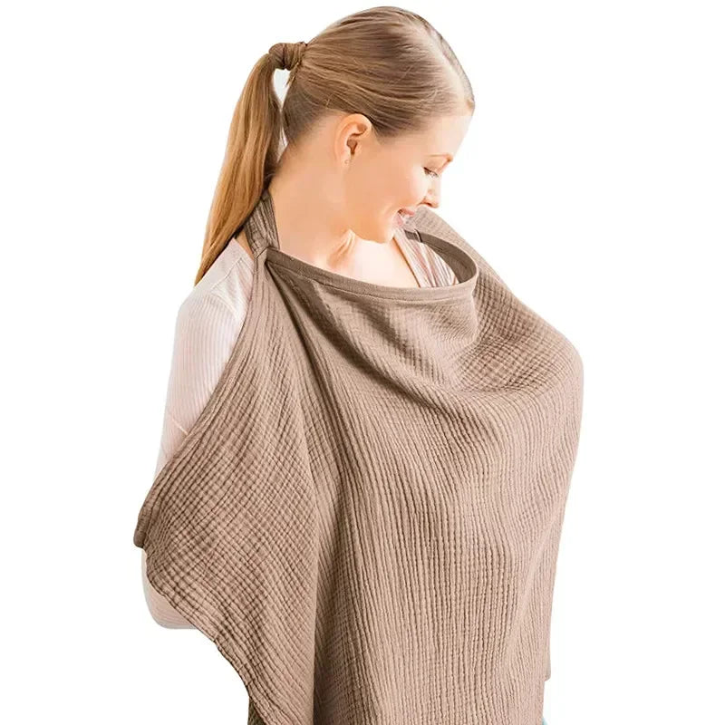 Nursing cover apron draped over baby while feeding, ensuring privacy and comfort for breastfeedi