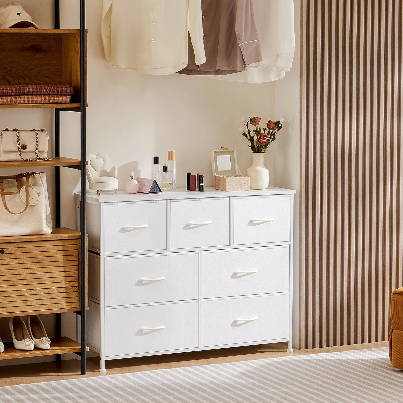 White nursery fabric storage dresser with colorful soft-edge drawers, perfect for baby accessories.