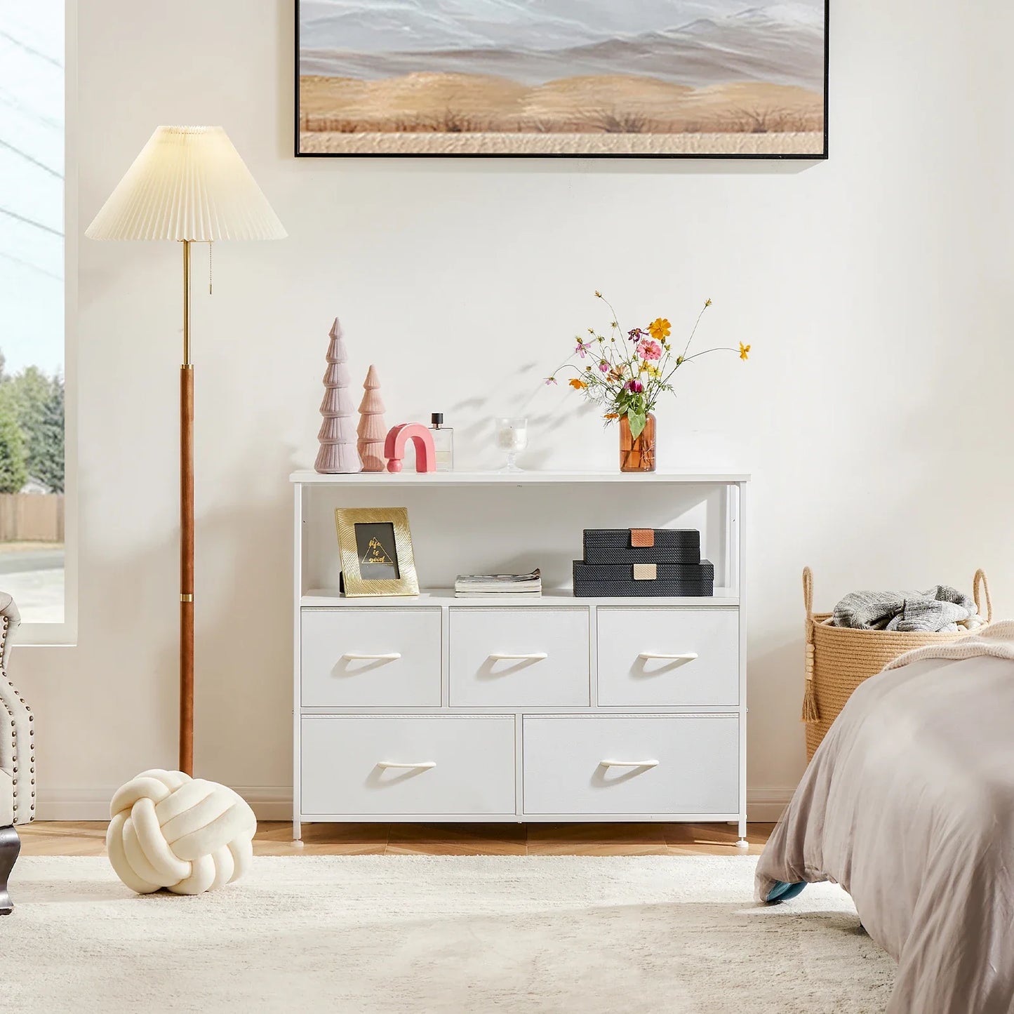 Soft-edge white dresser with fabric drawers, a safe and practical storage solution for children's rooms.