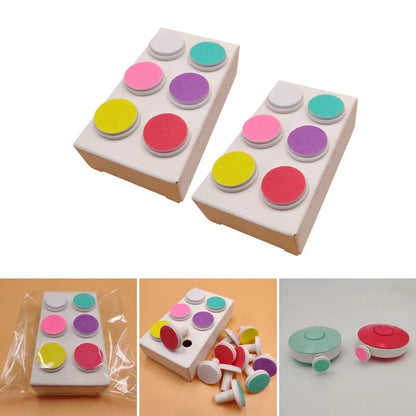 Electric baby nail trimmer replacement heads in a tray, essential for baby health and grooming