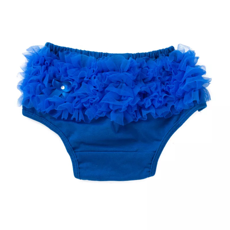 Baby's legs peeking from under a pink ruffled diaper cover, cute baby fashion for infants