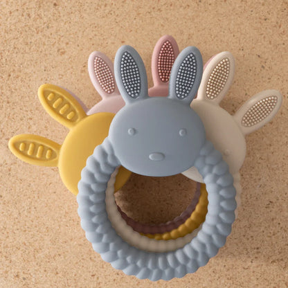 Pink silicone rabbit teether, gentle teething toy for infants, promotes oral development