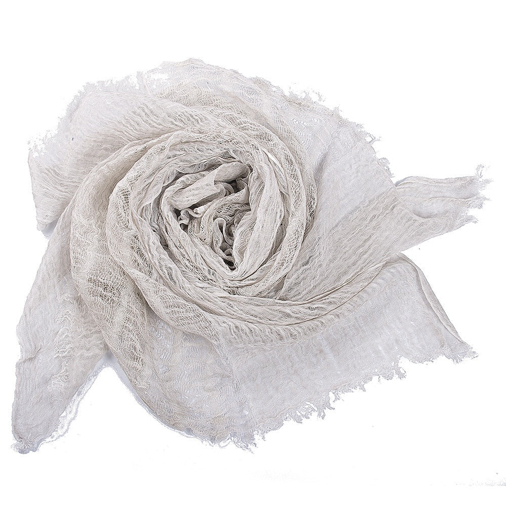 Baby wrapped snuggly in a breathable cotton swaddle, showcasing infant comfort & security.