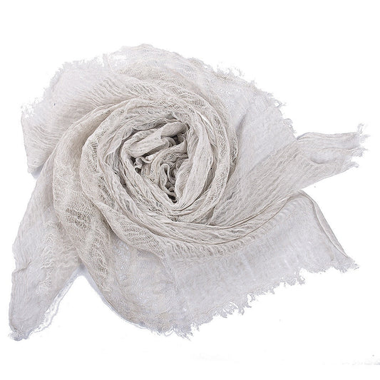 Baby wrapped snuggly in a breathable cotton swaddle, showcasing infant comfort & security.