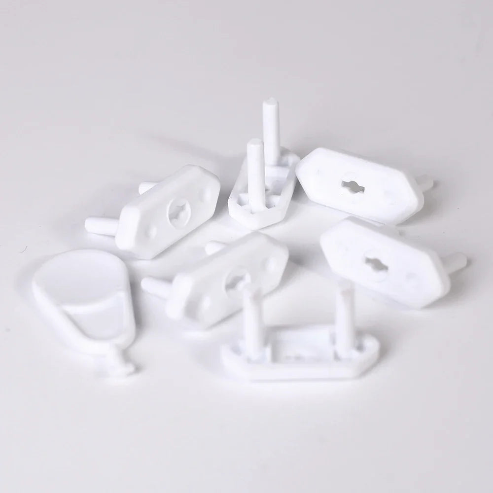 White universal safety outlet plug covers, 20-piece set for baby proofing electrical sockets.