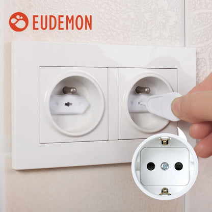 Child proofing electrical outlets with a white plug cover - a simple home safety solution.