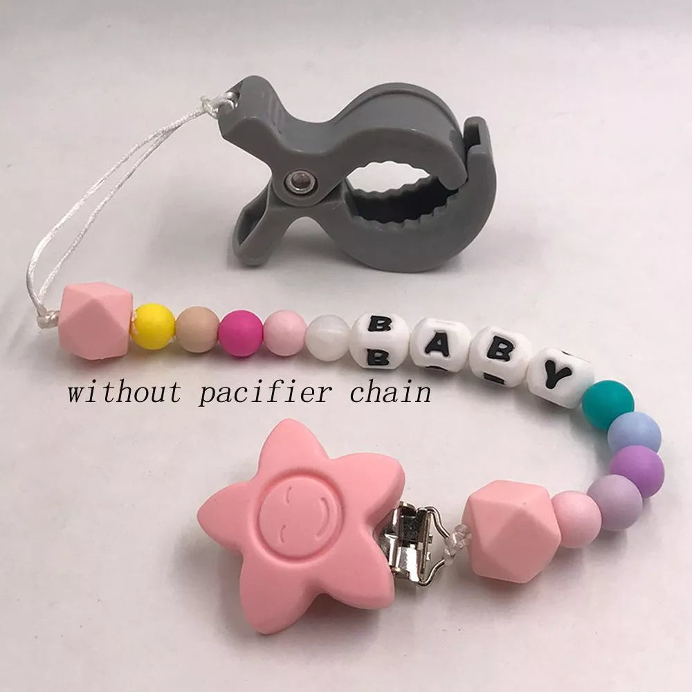 White stroller clip hooks, set of two, showcasing their compact and durable design
