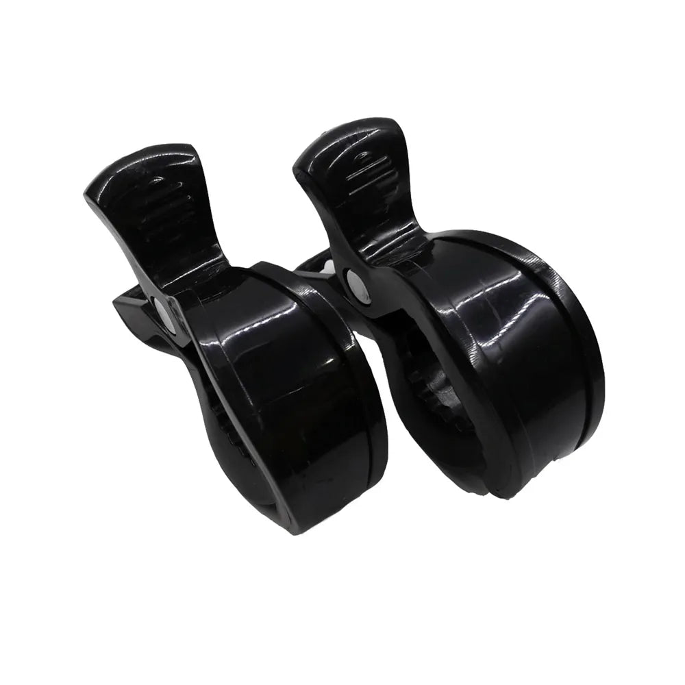 Essential baby gear: pair of white stroller clips for organizing essentials on the go