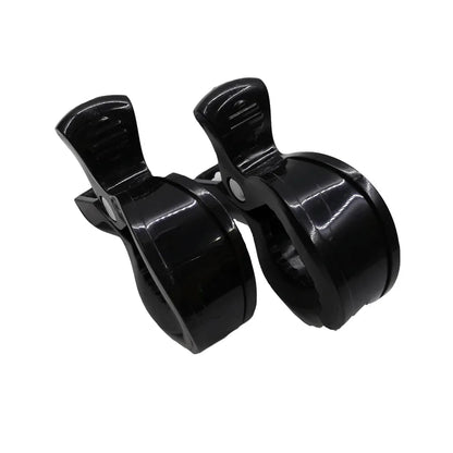 Essential baby gear: pair of white stroller clips for organizing essentials on the go
