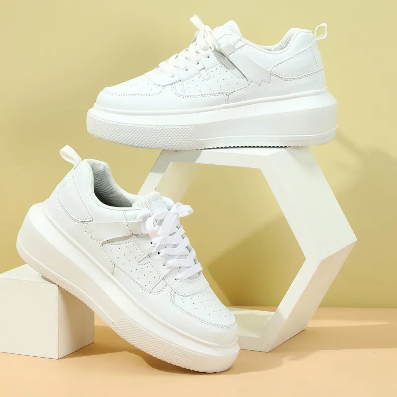 White women's platform sneakers with lace-up closure & perforated detail. Trendy casual athletic shoes.