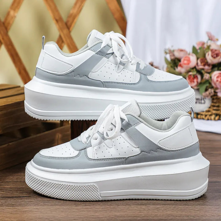 Fashionable black women's platform sneakers, detailed with perforated pattern & sturdy lace-up front.
