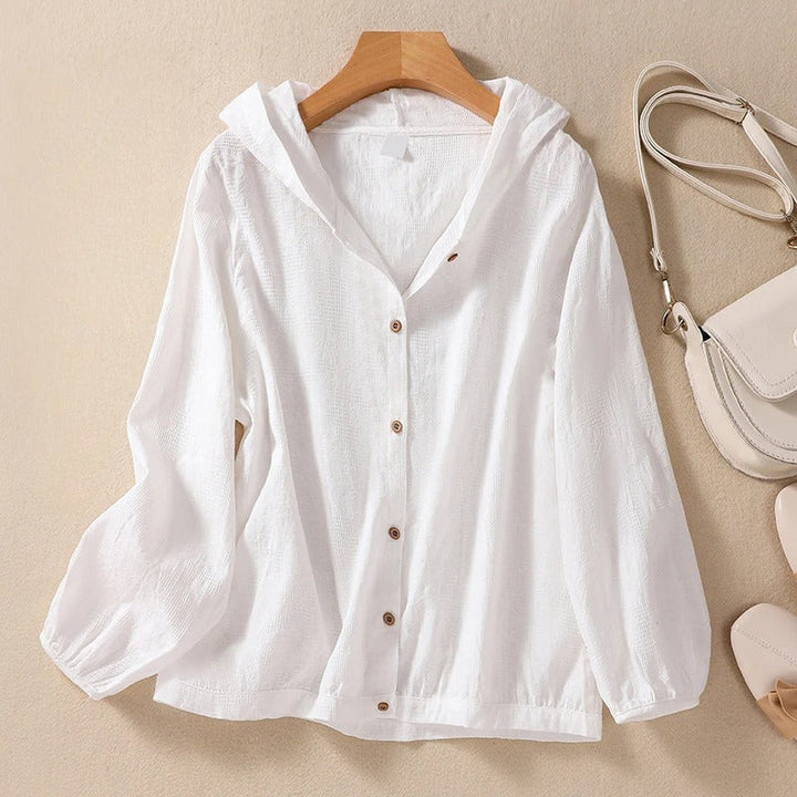White women's relaxed fit hooded shirt, perfect for casual layering & comfortable everyday style.