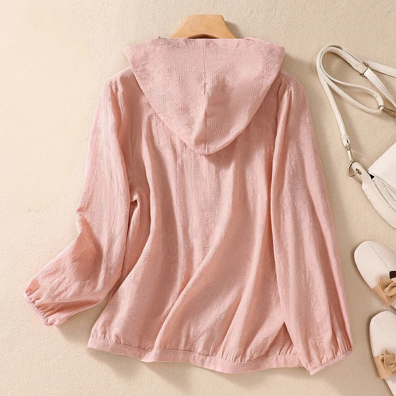 Pink relaxed fit women's hooded shirt, a comfortable and versatile top for casual wear.