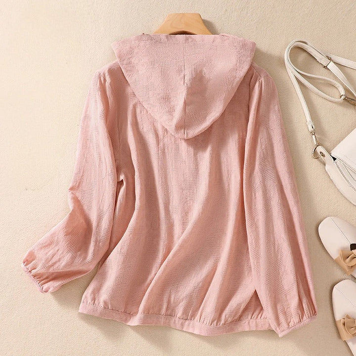 Pink relaxed fit women's hooded shirt, a comfortable and versatile top for casual wear.