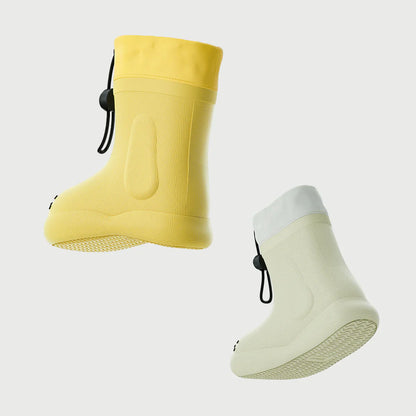 Children's waterproof rain boots featuring a fun dog design, ideal for outdoor play.