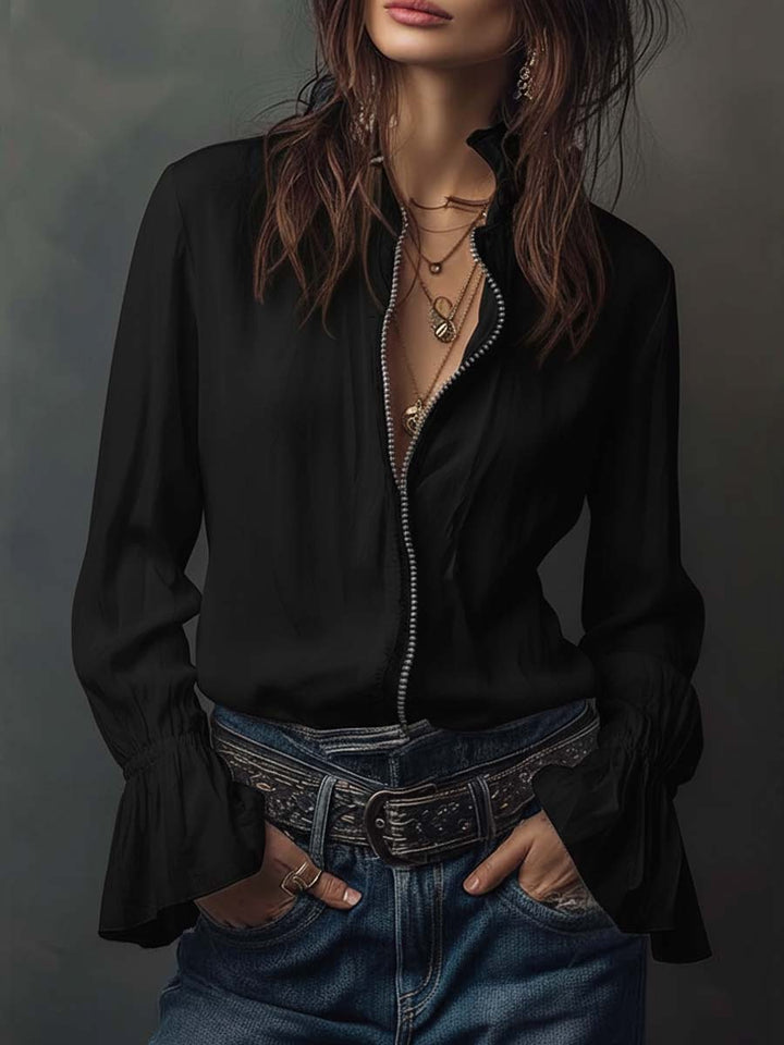 Crisp white women's blouse, zip-front style with distinctive bell cuffs, perfect for an elegant or casual look.