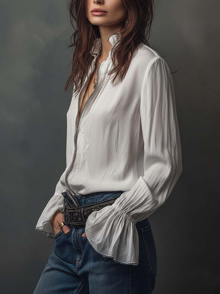Chic white long-sleeve blouse for women, featuring a modern zip front & stylish bell cuffs. Versatile top.