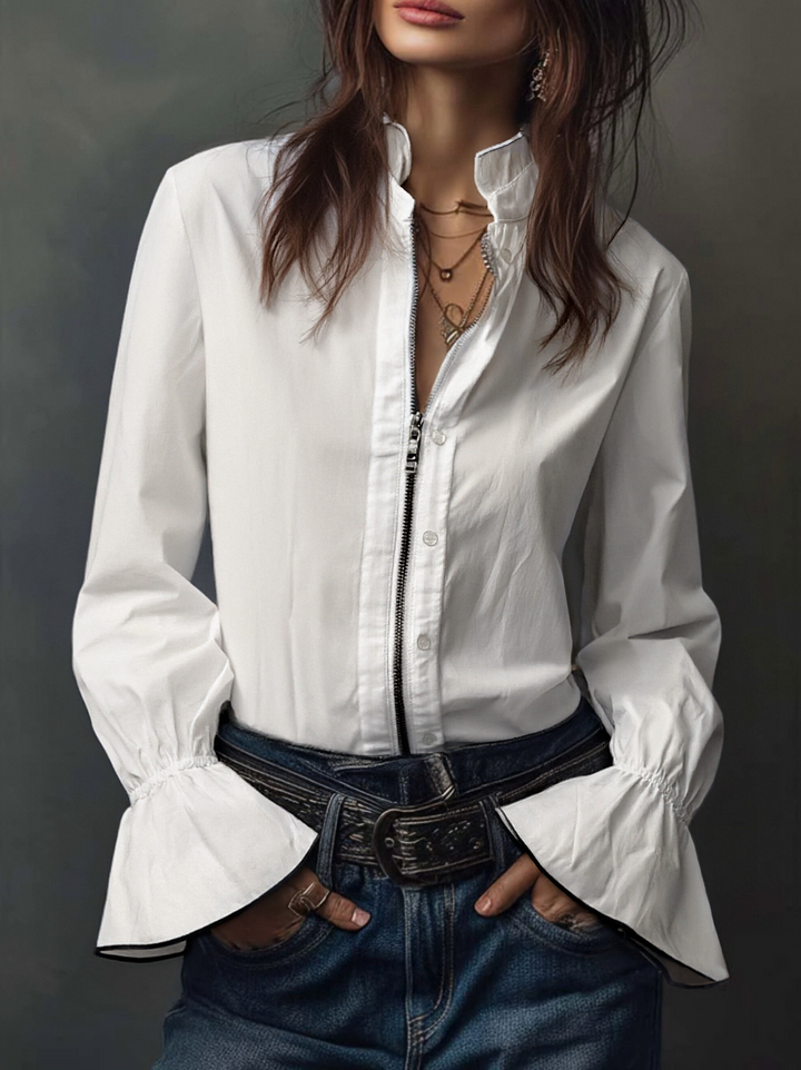 Versatile white long-sleeve blouse with a zip front & bell cuffs. Ideal for professional or casual chic looks.