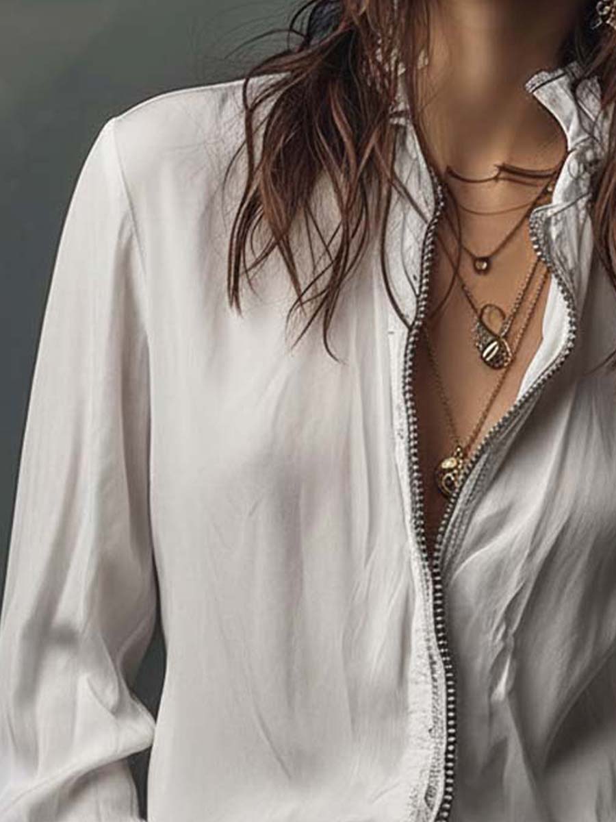 Sophisticated white zip-front blouse for women, designed with flowing bell cuffs & long sleeves. Elegant shirt.