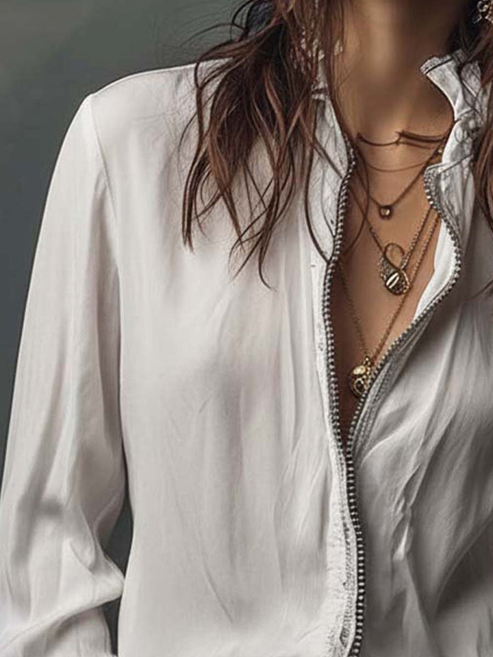 Sophisticated white zip-front blouse for women, designed with flowing bell cuffs & long sleeves. Elegant shirt.