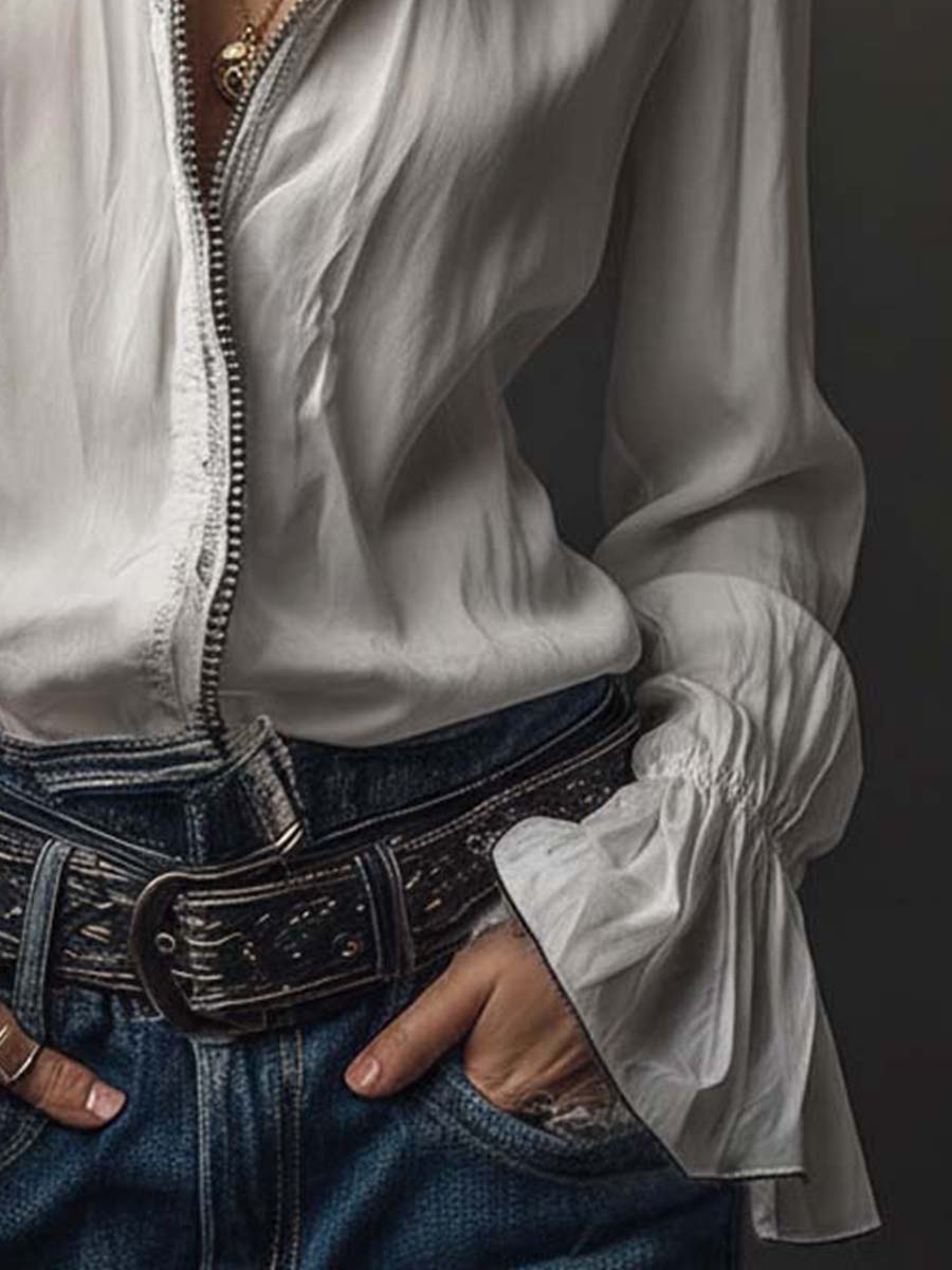 Clean white women's long-sleeve blouse with a contemporary zip front & stylish bell cuffs. Casual or office.