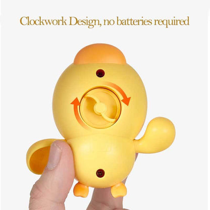 Close-up of a wind-up mechanism on a yellow swimming duck bath toy