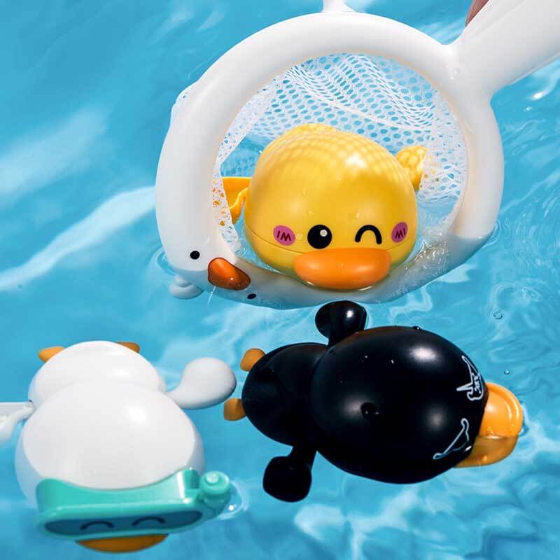 Cheerful wind-up swimming duck bath toy gliding across the water surface