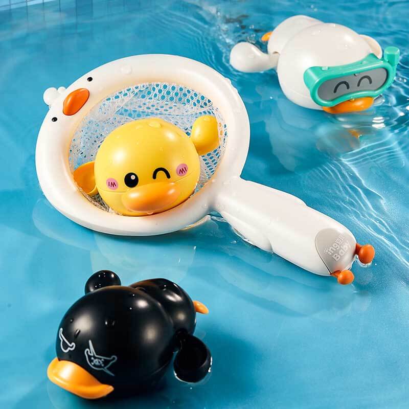 Kids' bath time with a floating wind-up yellow duck toy for entertainment