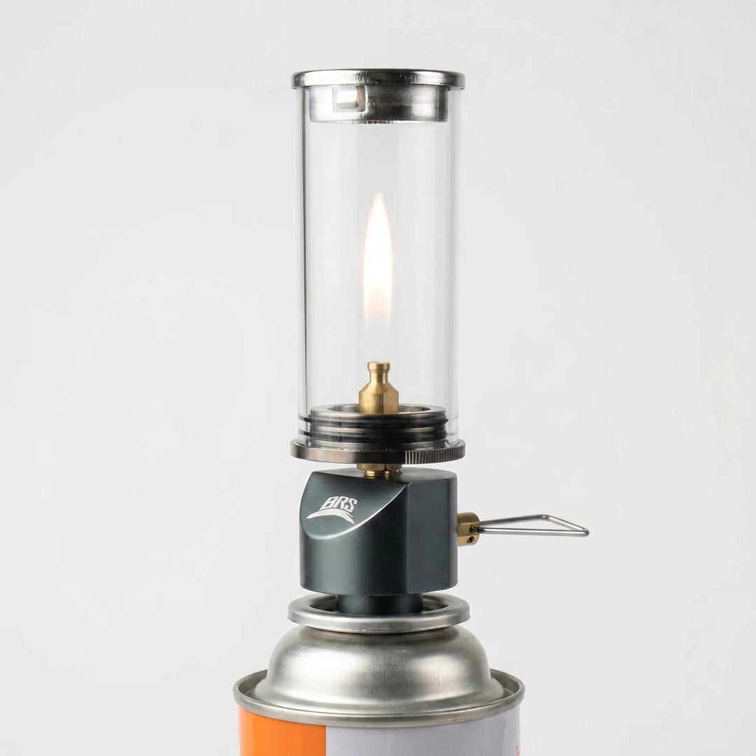 Windproof gas candle camping lamp, perfect for outdoor ambiance, tent lighting, and portable campsite use.