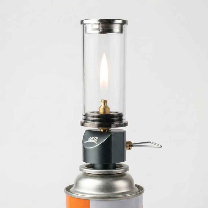 Windproof gas candle camping lamp, perfect for outdoor ambiance, tent lighting, and portable campsite use.