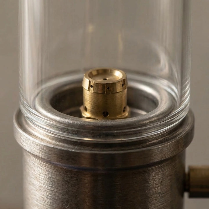 Compact & portable gas candle camping lantern. Windproof design ensures steady, warm light for any outdoor adventure.