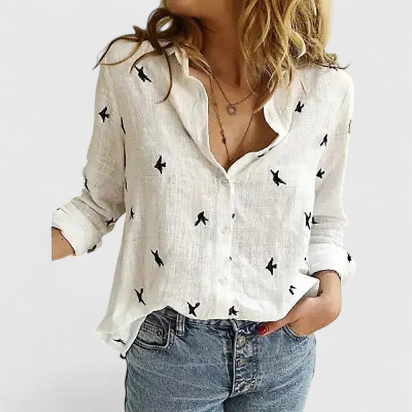 Women's stylish floral V-neck blouse with long sleeves, perfect for elegant fashion wear.