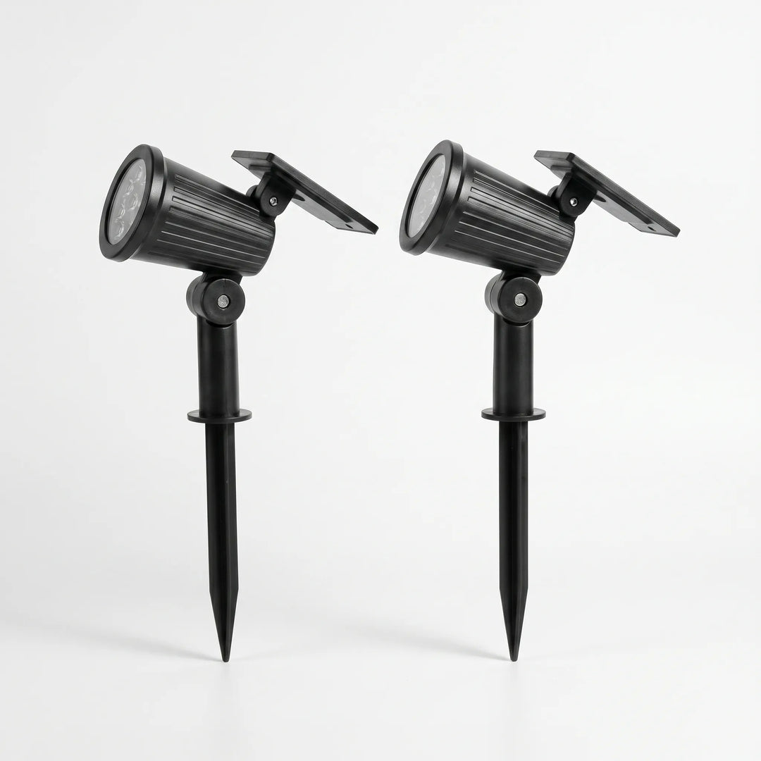 Ground stake solar LED spotlight for pathway lighting, adjustable beam.