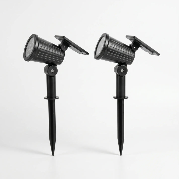 Ground stake solar LED spotlight for pathway lighting, adjustable beam.