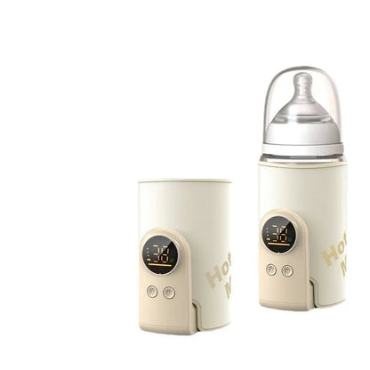 Hand holding wireless portable baby bottle warmer, illustrating its ergonomic design for on-the-go use.