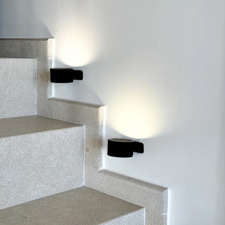 Close-up of LumoFlex wireless dimmable wall lamp showing touch control panel and LED light.