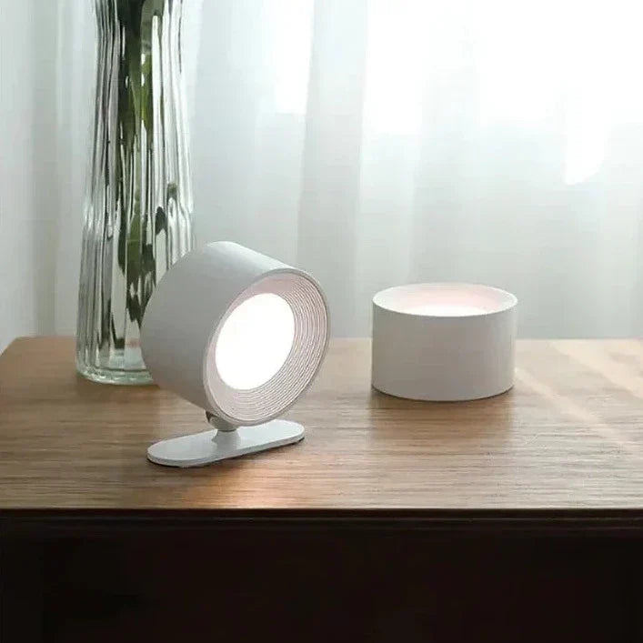 LumoFlex wireless rechargeable wall lamp, casting a soft, dimmable LED glow on a modern wall.