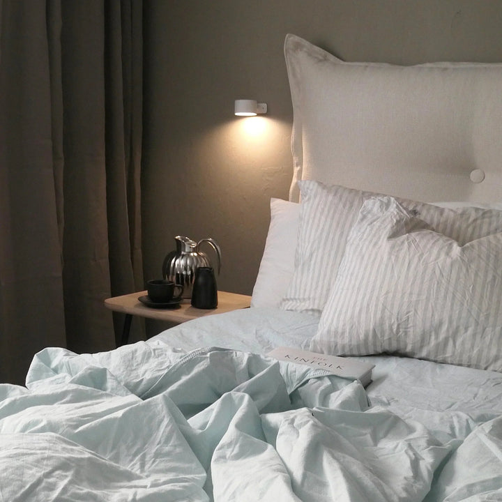 Energy-efficient LumoFlex wireless rechargeable wall lamp, modern dimmable LED lighting solution.