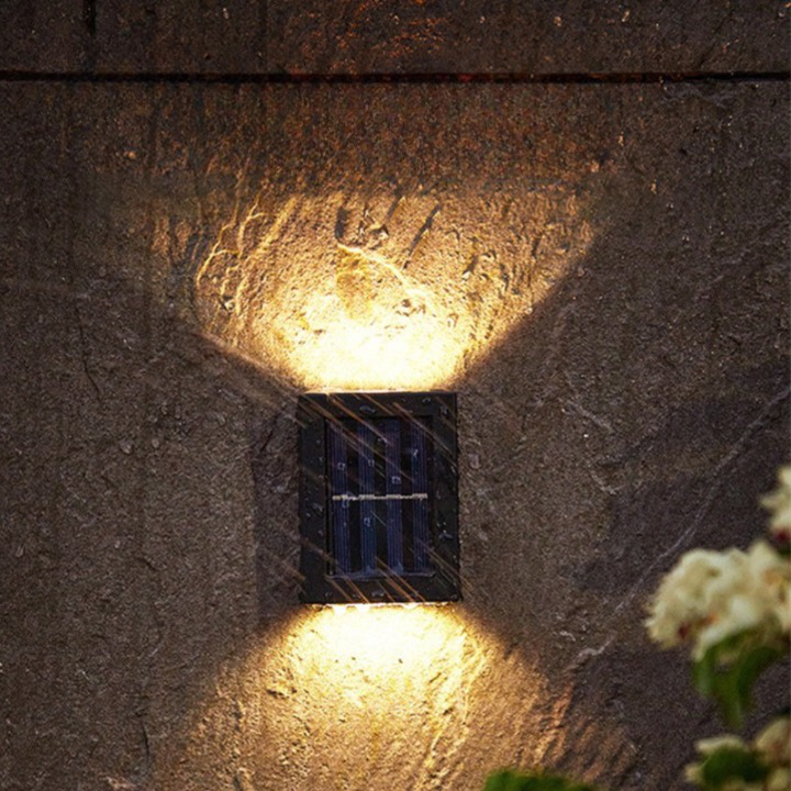 Versatile solar LED wall lamp. Wireless, energy-saving outdoor lighting for garden, patio, driveway security.