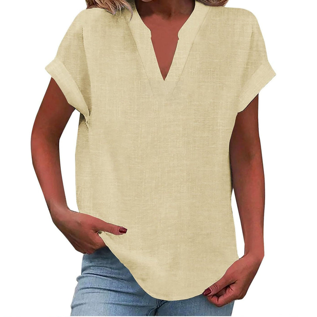 Side view of woman in chic relaxed fit V-neck blouse, demonstrating flowy fit for effortless style.