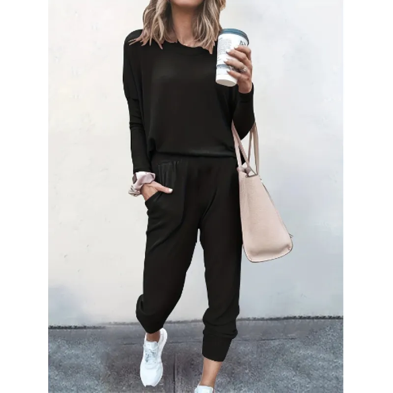 Women's relaxed fit black jogger pants with elastic waist, part of a comfortable two-piece lounge wear set.