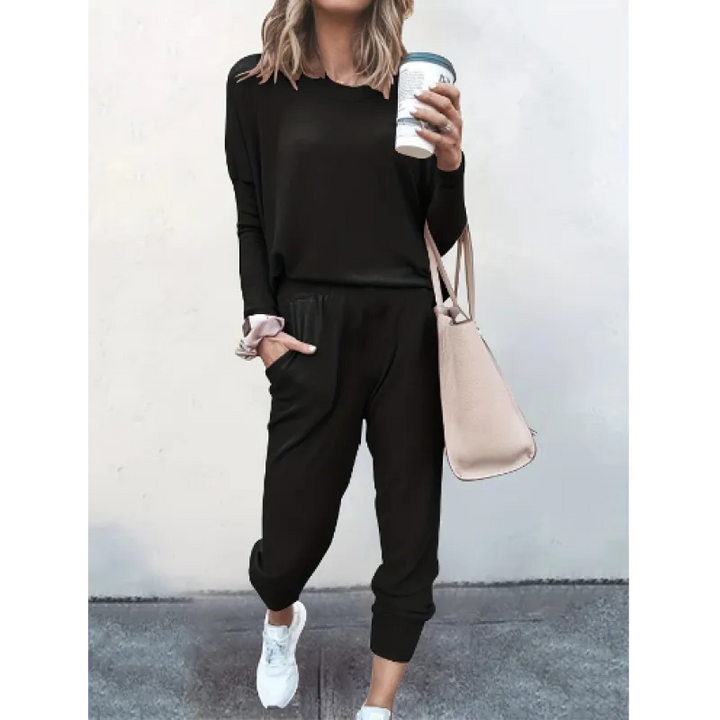 Women's relaxed fit black jogger pants with elastic waist, part of a comfortable two-piece lounge wear set.